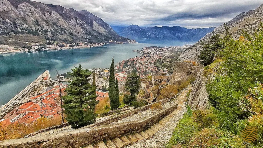 The Bay of Kotor and the Old Town rooftops seen from the stone path to St John's Fortress, Kotor