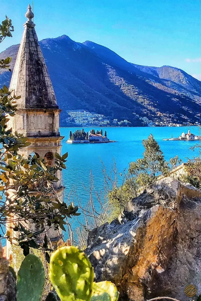 The bell tower of St Nicholas in Perast, with the islands of St George and Our Lady of the Rocks in the Bay of Kotor