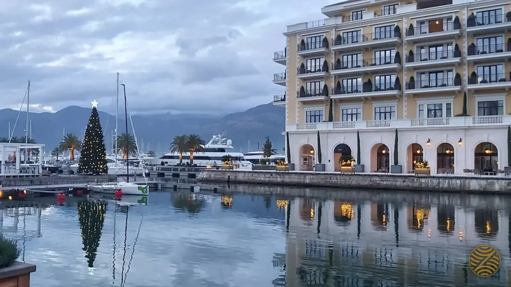 Regent Porto Montenegro hotel and marina in winter, with yachts and the mountains of the Bay of Kotor, Tivat