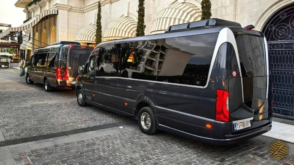 Two black VIP Mercedes Sprinter minibuses waiting at the entrance of Regent Porto Montenegro, Tivat