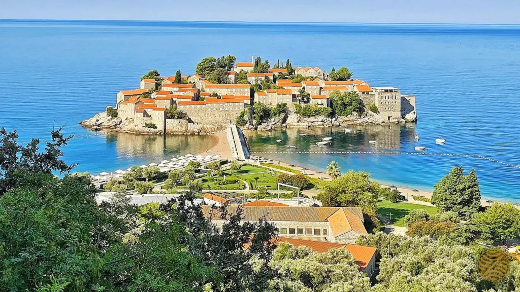 Sveti Stefan island and its pink-sand beach seen from the hills above the Budva Riviera